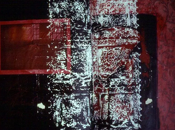 A page printed and painted in red, black and white.