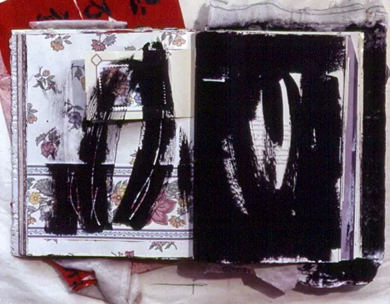 Two pages of black brushwork on floral paper.