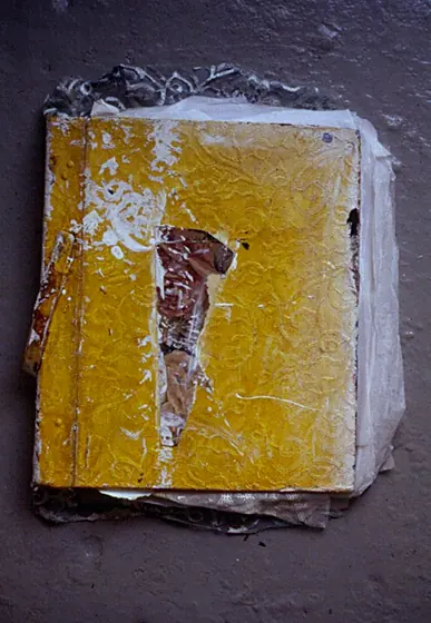 A yellow book cover with a collaged figure.