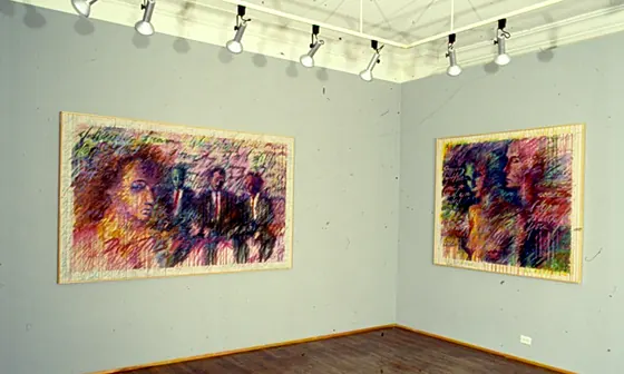 Two framed Diary paintings hanging in a gallery room with a wooden floor and track lighting.